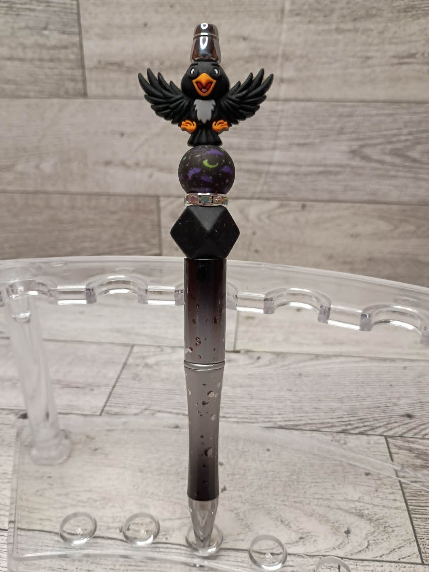 Rave4n Beadeed Pen on a stand