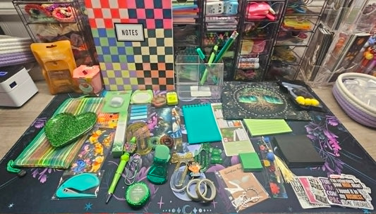 Assorted stationery items on a table with colorful backgrounds