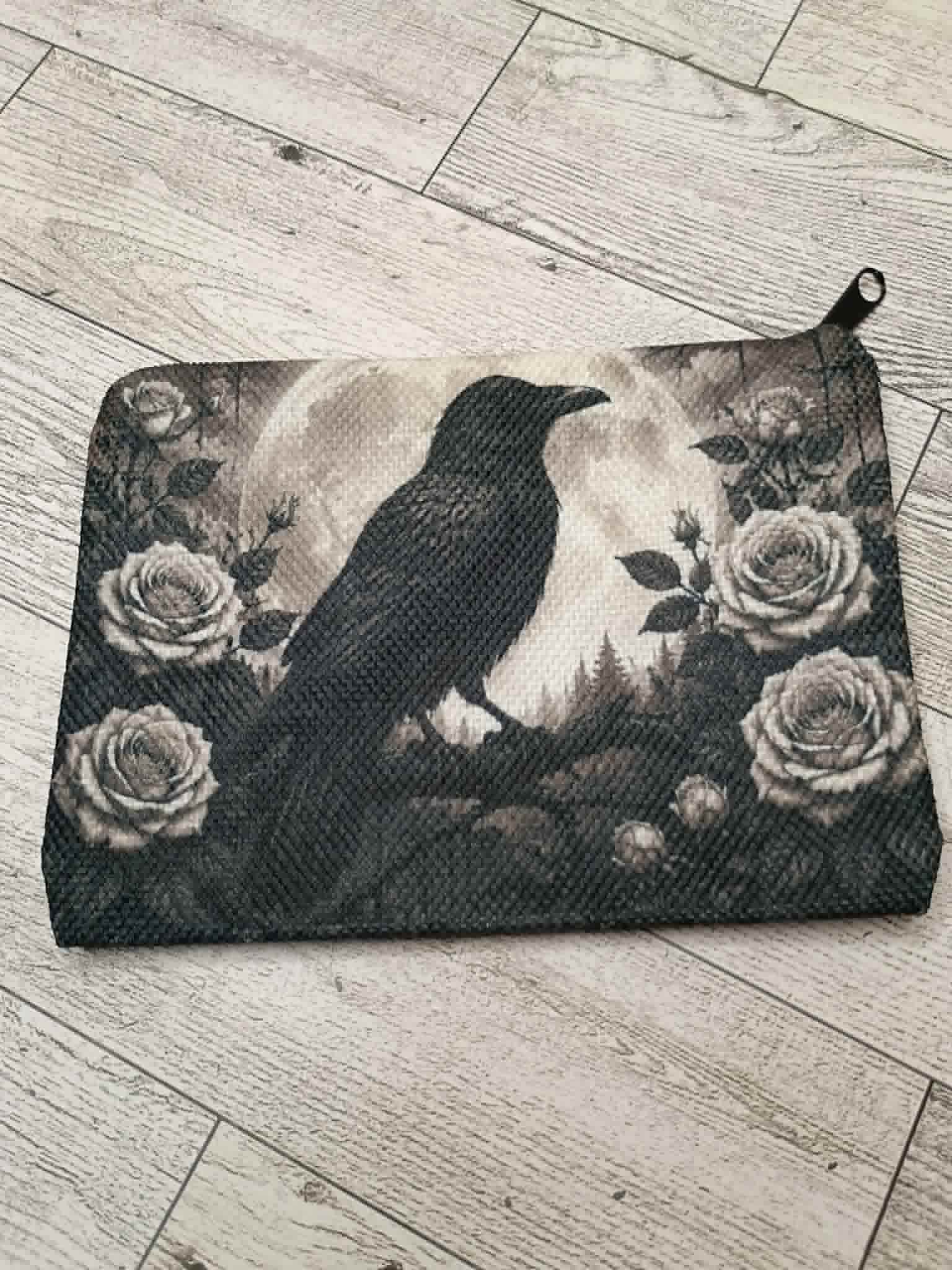 Raven coin purse on a desk