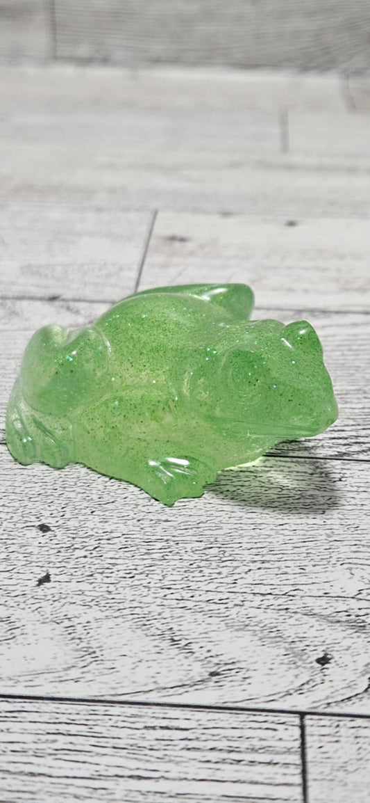 Green jelly-like substance on a wooden surface