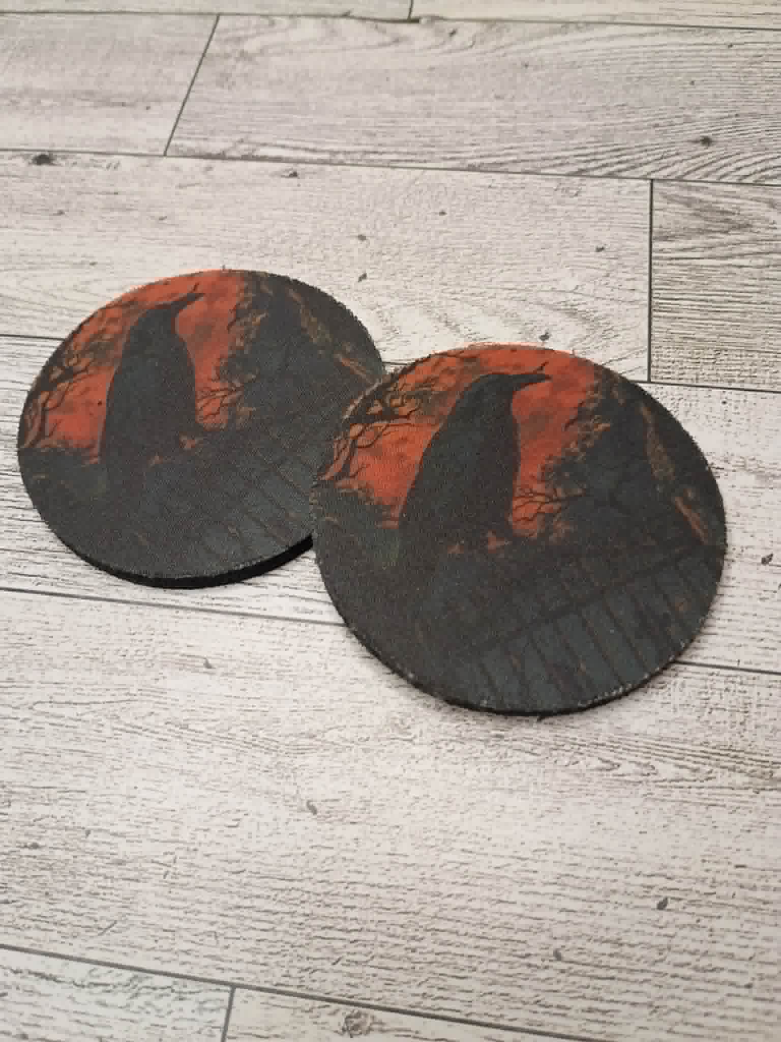 Raven car coasters on a desk